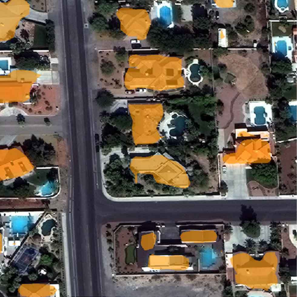 A satellite image of a suburban neighborhood with buildings highlighted